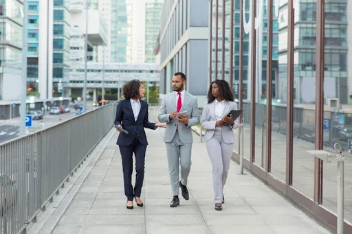 three business people walking down streets